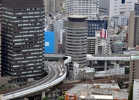 Construction gate tower building with a highway through it osaka japan